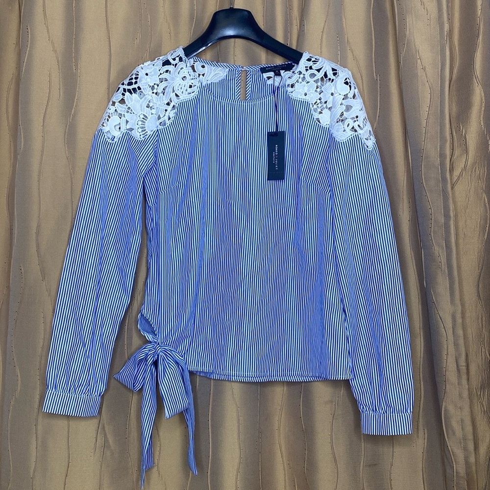 Romeo and Juliet Couture Blue & white striped top with lace shoulder accent.